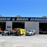Staff outside the front of the HDS Brisbane workshop